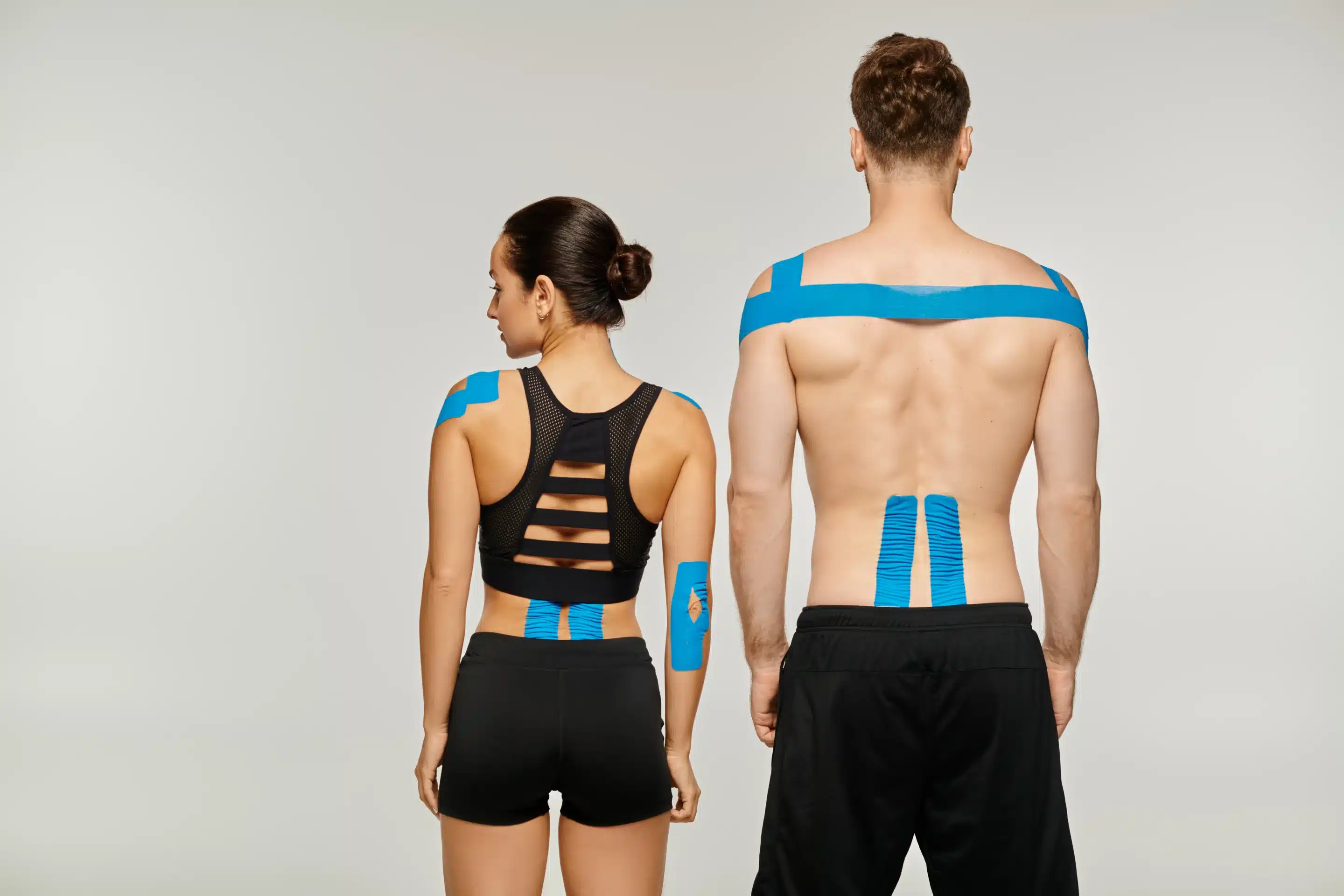 Houston Chiropractor applies kinesiology Tape